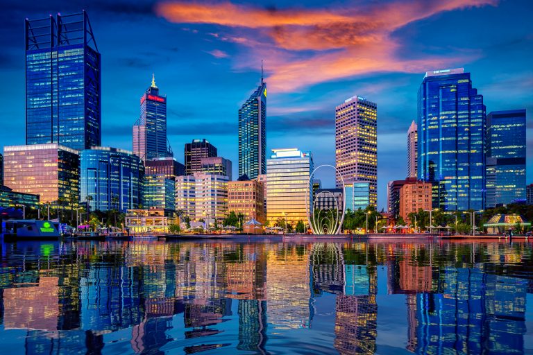 Perth skyline, the capital of Western Australia, reflected in the Swan River at sunset.