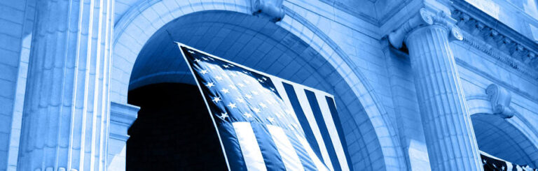 A large domed government building under a stylized blue and sepia color filter.