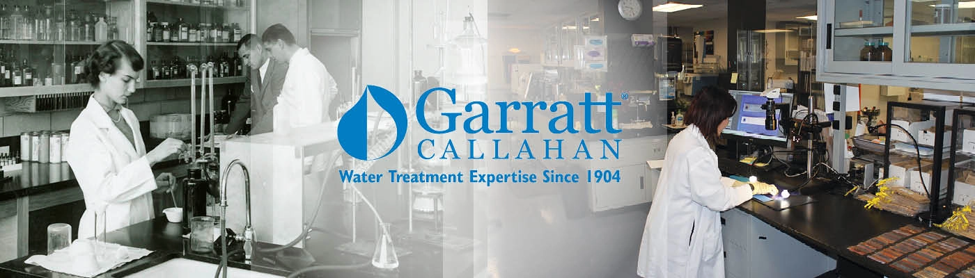 A banner image for Garratt Callahan, a water treatment company, with "Water Treatment Expertise Since 1904" written below the logo. The banner features two blurred black and white images of scientists in a laboratory on the left and right, flanking the company logo and text.