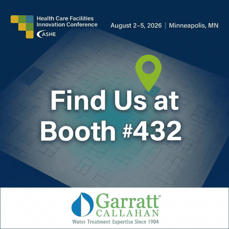 An announcement graphic with a dark blue background featuring a faint convention floor plan schematic. Text at the top, in white and blue, identifies the event: 'Health Care Facilities Innovation Conference' with the ASHE logo, followed by the dates 'August 2-5, 2026' and the location 'Minneapolis, MN'. The center of the image has large, bold, white, shadowed text that reads: 'Find Us at Booth #432'. A green map pin icon is positioned just above and to the right of this central text. The bottom of the graphic has a white band containing the logo and text for 'Garratt CALLAHAN' (which includes a large blue water drop icon) and their tagline, 'Water Treatment Expertise Since 1904'.